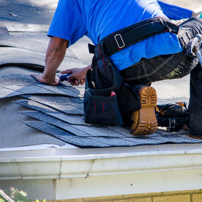 a man working on a roof