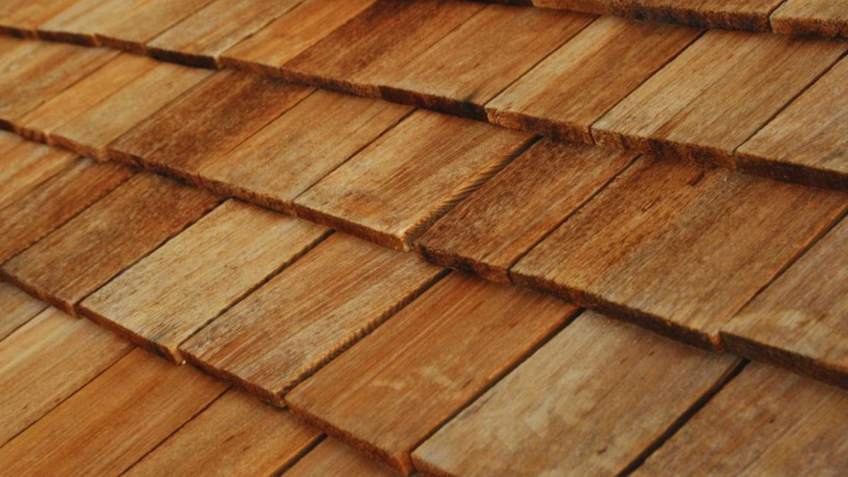 A close-up view of natural wood shingles neatly layered on a roof, showing their warm texture and classic appeal — a popular choice for residential roofing in Hardeeville, SC.