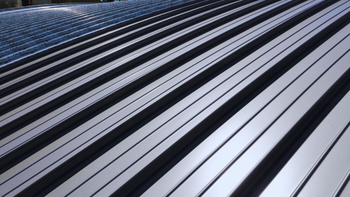 Close-up of a standing seam metal roof with durable, interlocking metal panels, highlighting the clean lines and weather-resistant design of modern metal roofing.